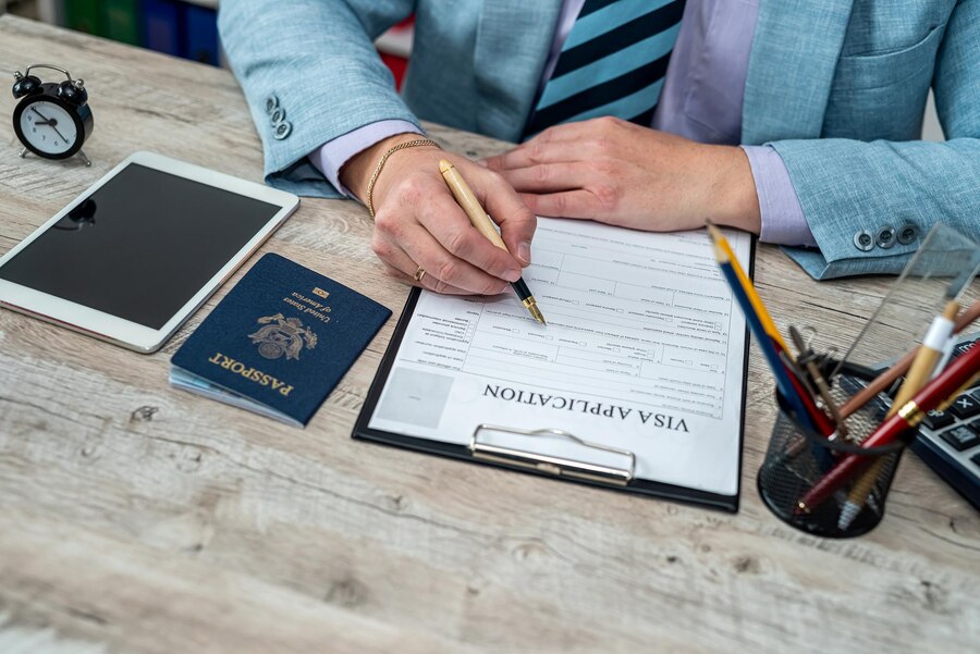 closeup male hands filling out visa documents table 359031 36826