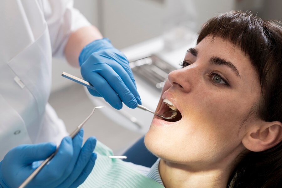 young female patient having dental procedure orthodontist 23 2148985769